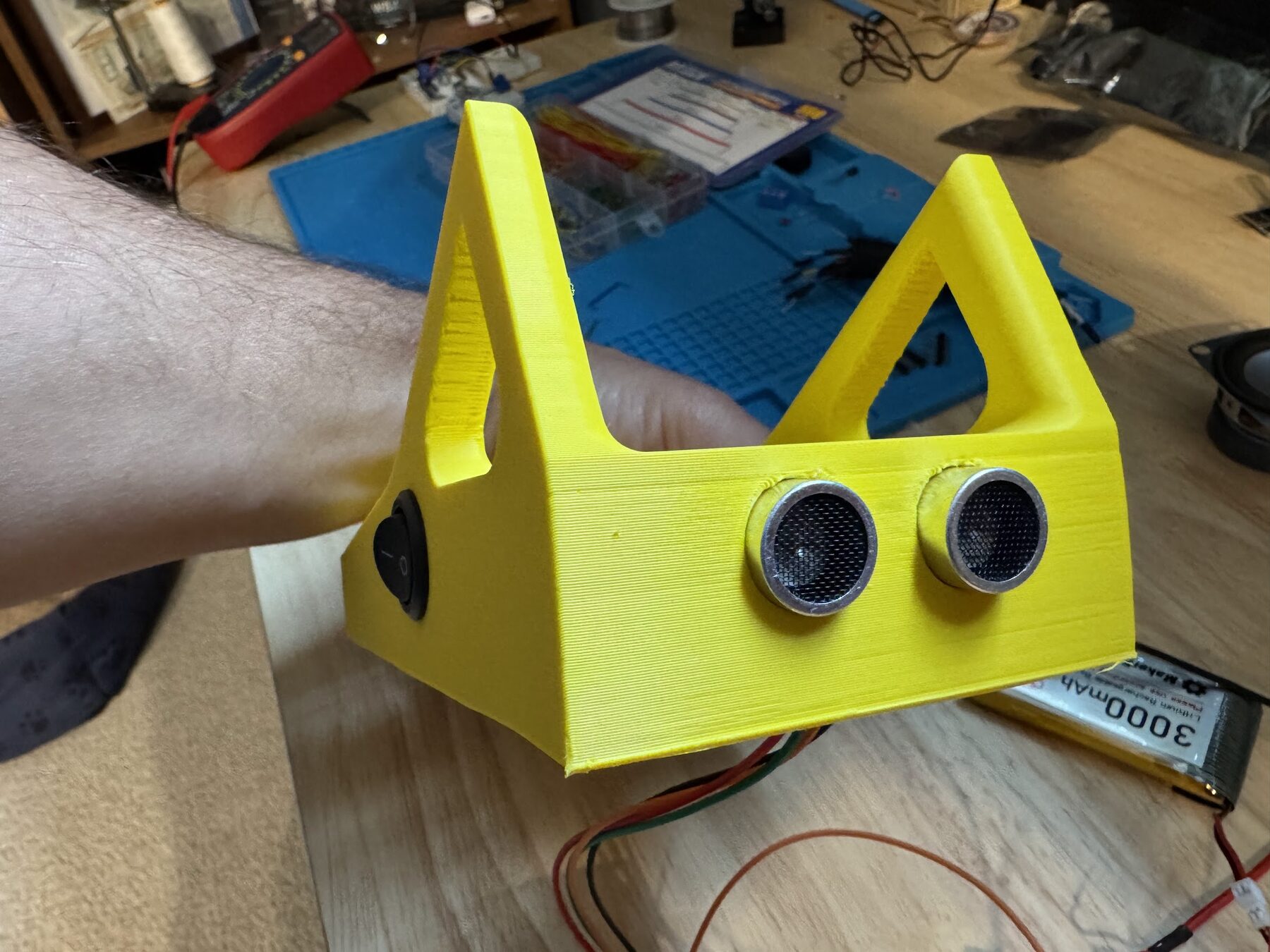 Yellow printed case with the ultrasonic sensor's two round transducers on the front