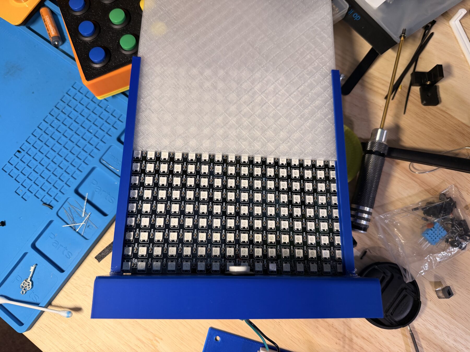 The bare 16x16 LED grid in the frame, with the PETG diffuser sliding in over it