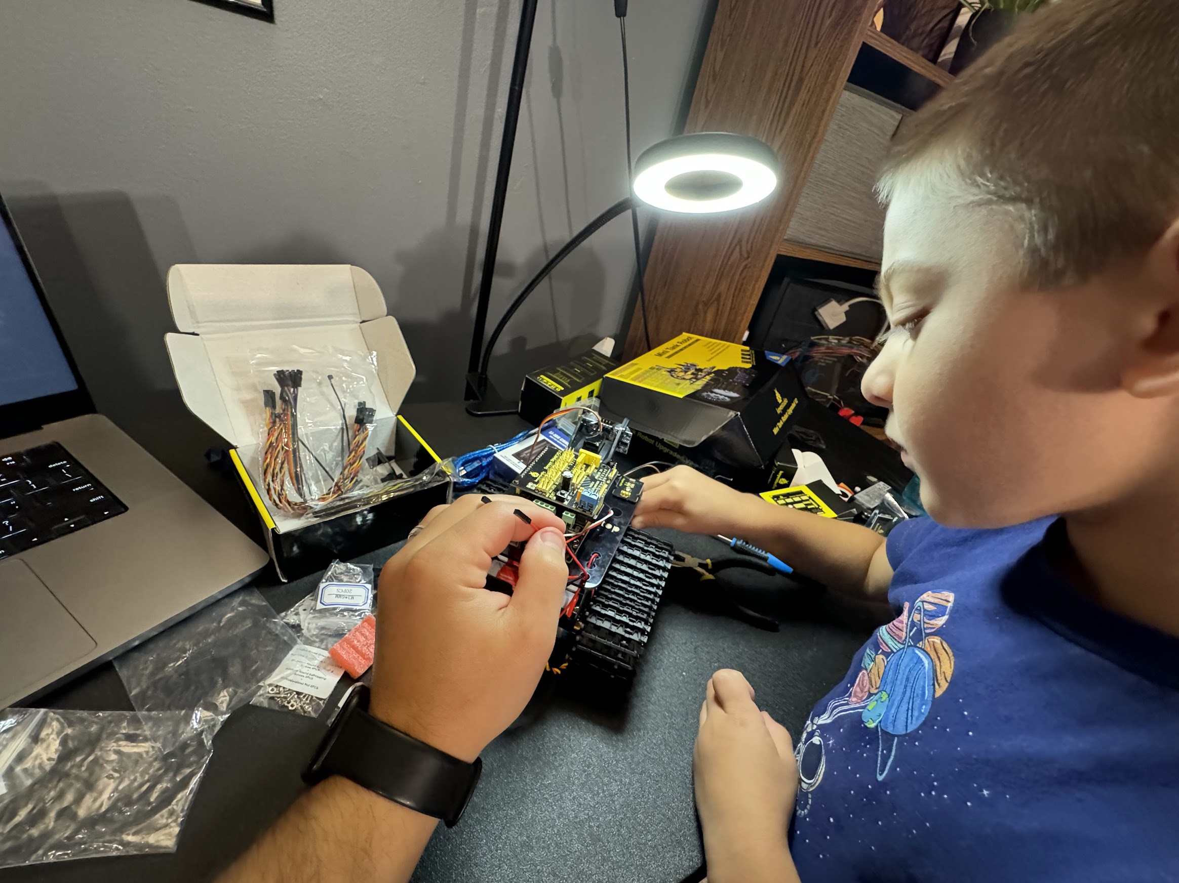 Sean guiding Jacob through the build process