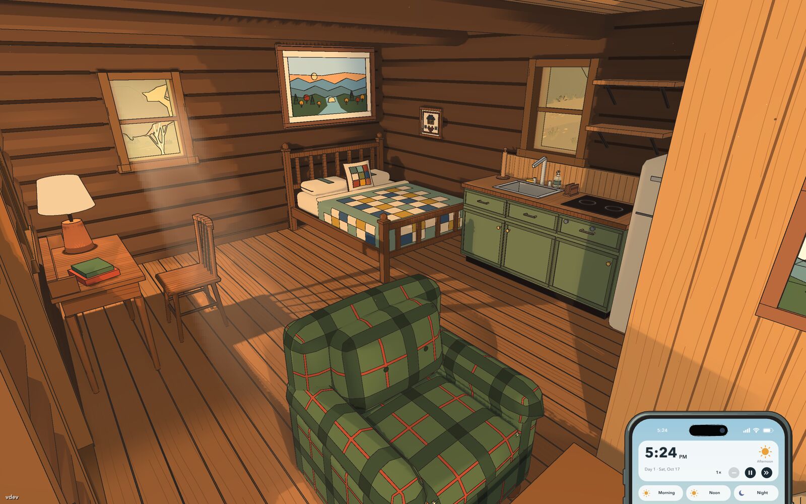 Inside the river cabin: a quilted bed, a plaid armchair and a small kitchen