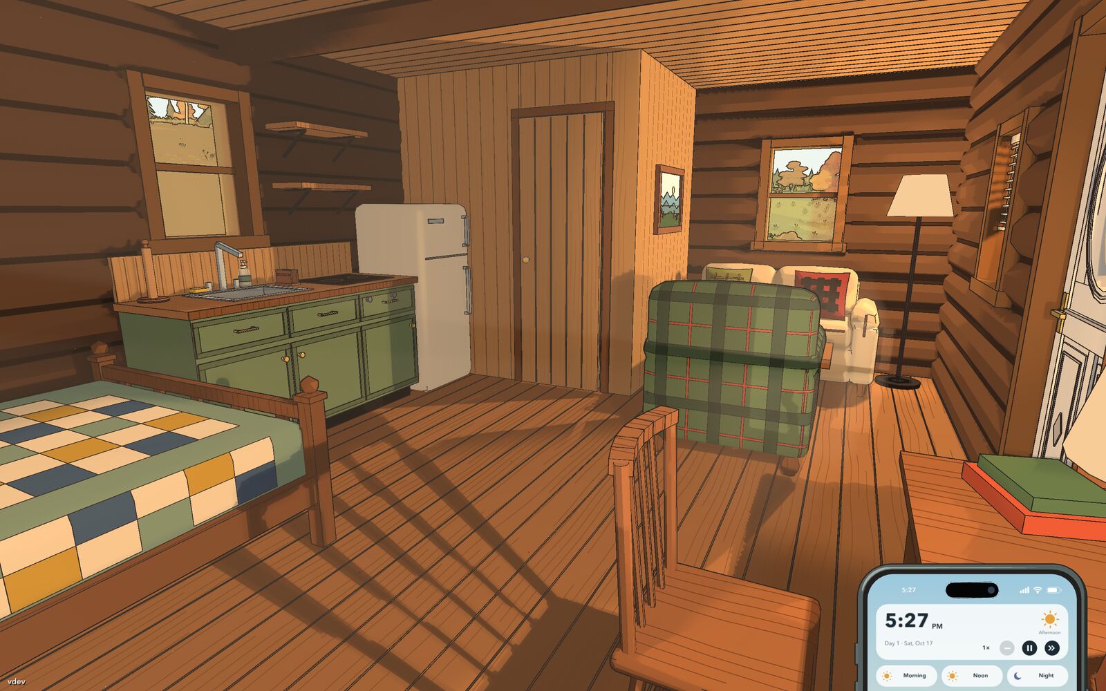 The river cabin room from the door, with the bed, kitchenette, fridge and armchair
