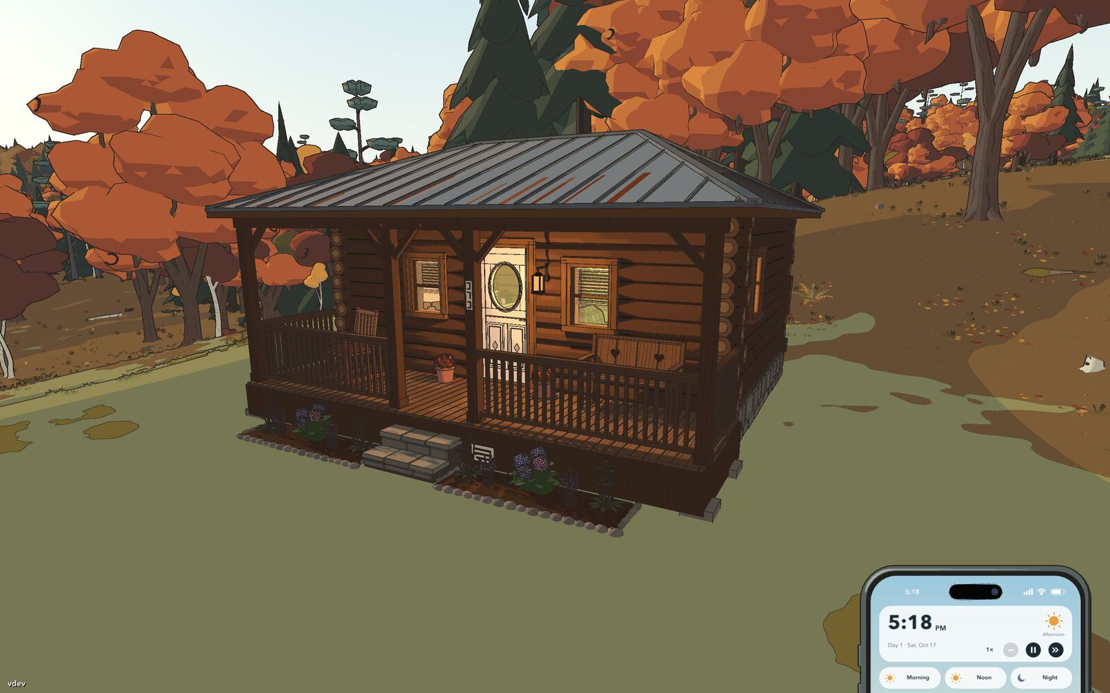 A small log cabin with a tin roof and a porch, surrounded by autumn trees